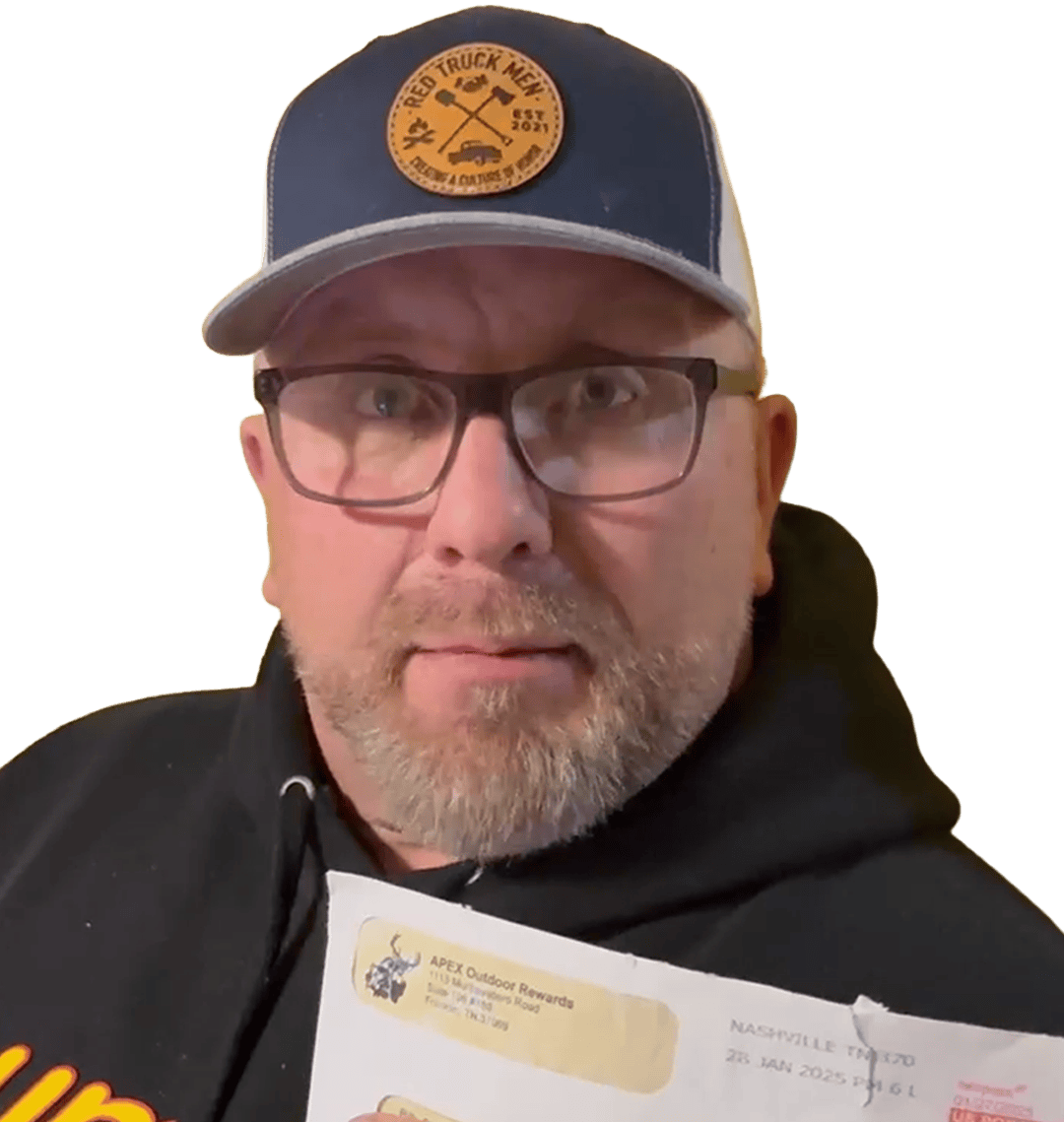 Billy Stewart holding an APEX reward check