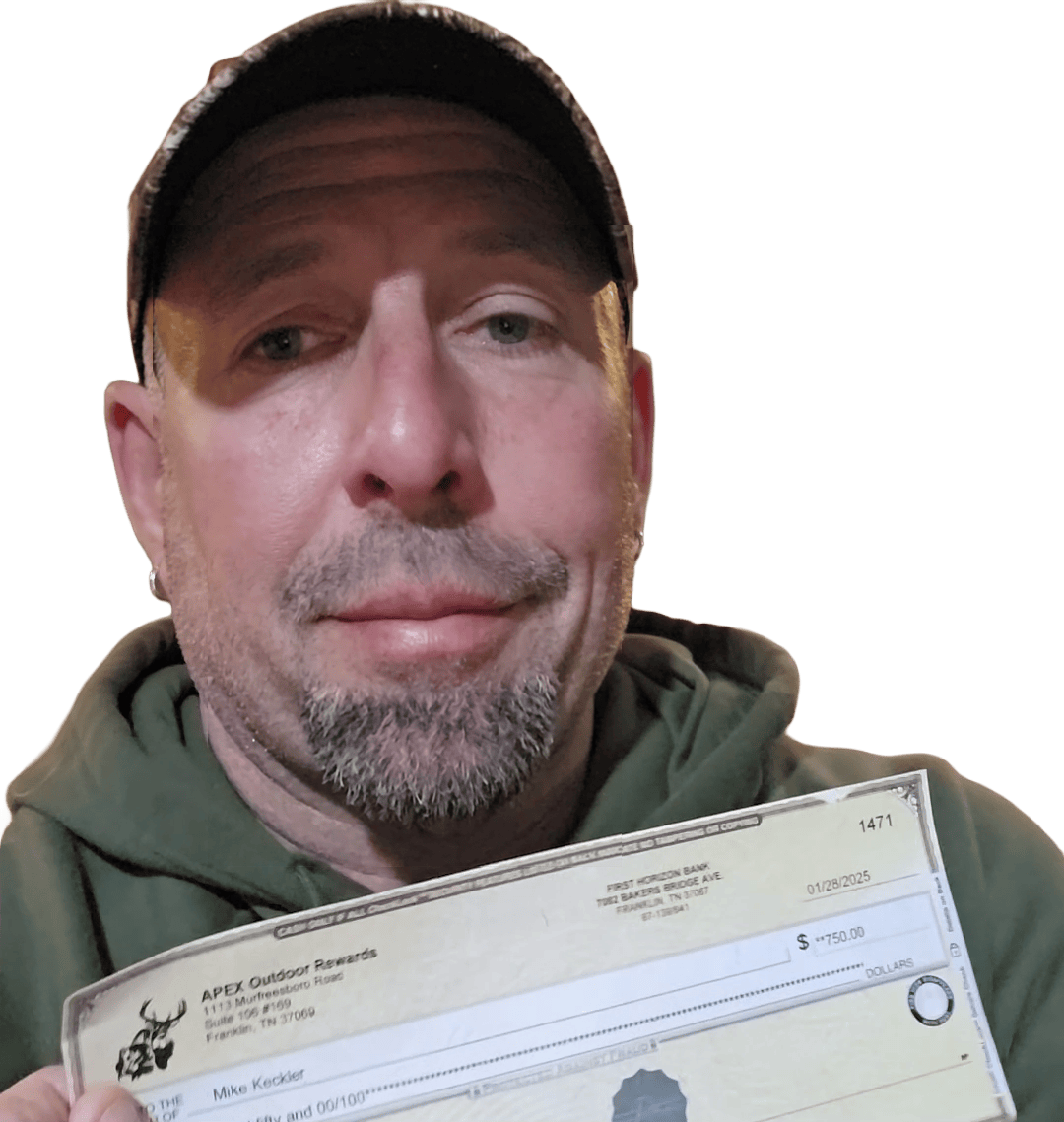 Mike Keckler holding an APEX reward check